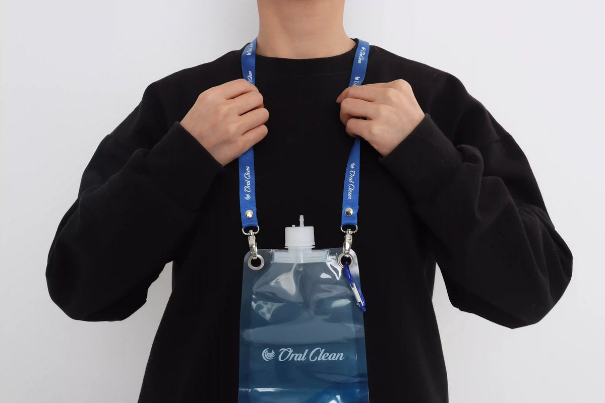 He is wearing a foldable pouch around his neck.